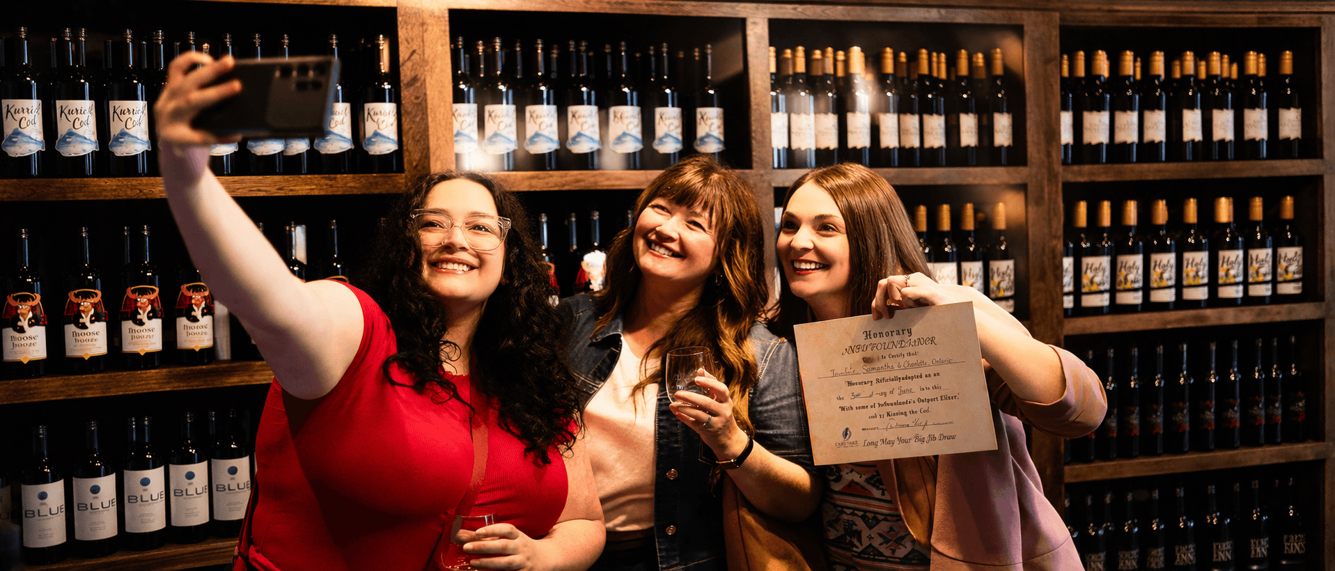 Guests celebrating a screech-in with a certificate at Great Auk Winery